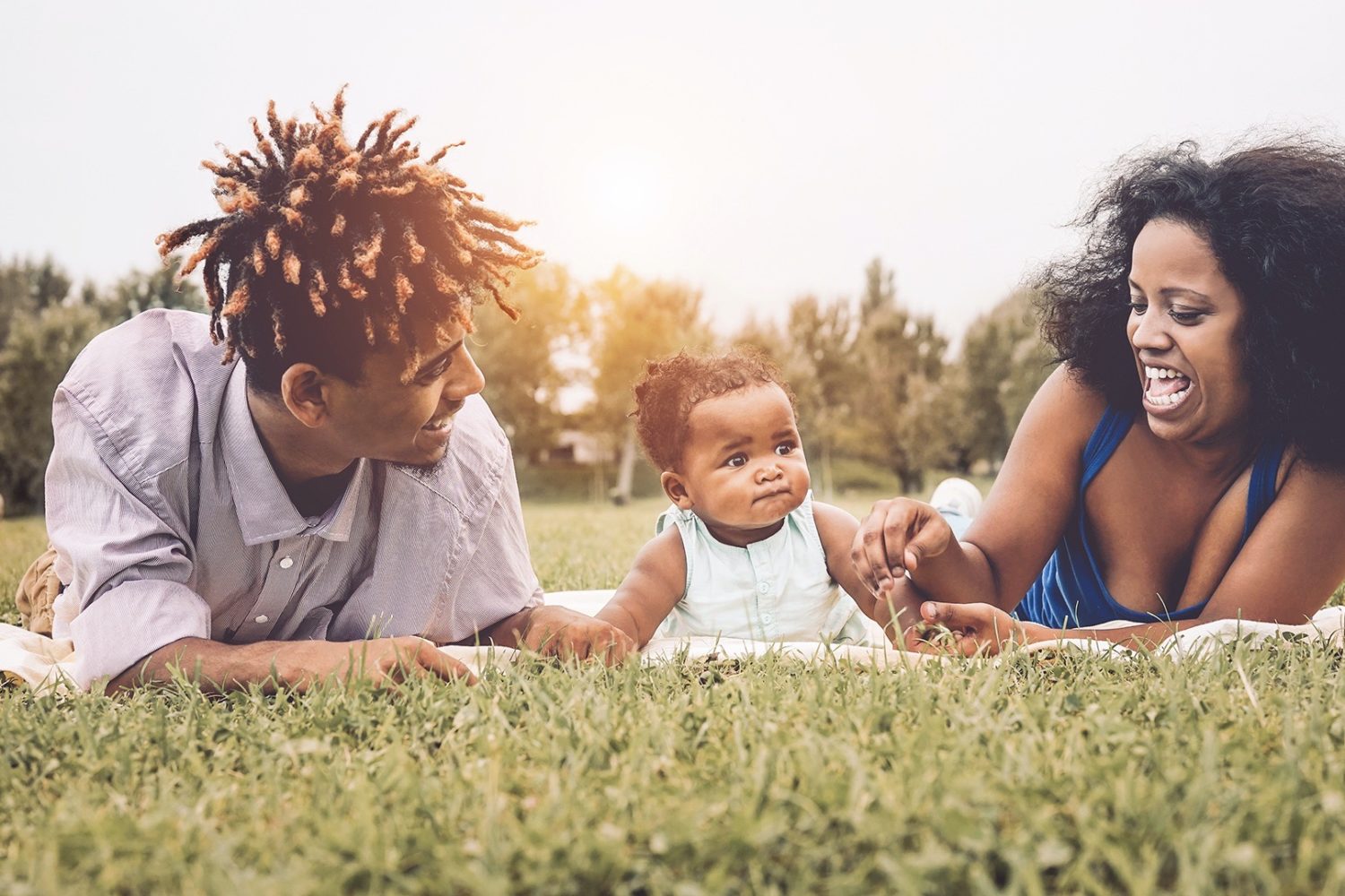 Parents sharing a warm moment with their child outdoors